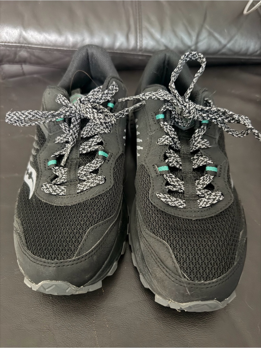 Saucony Black Mesh Trail Shoes with Teal Eyelet Accents